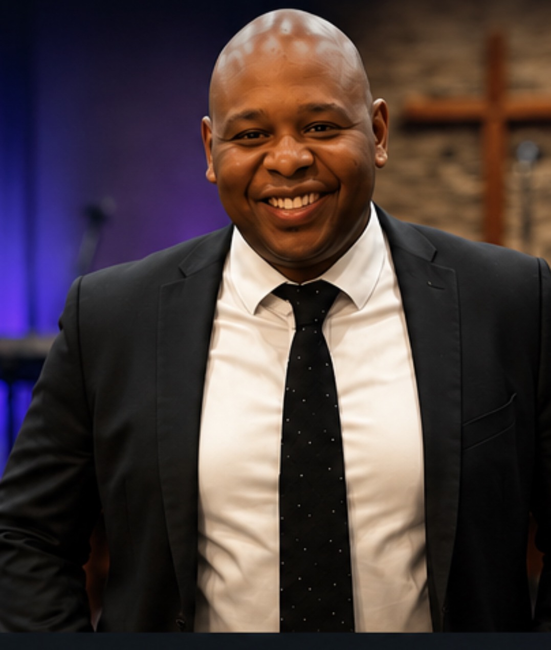 Dennis Gates in a black suit